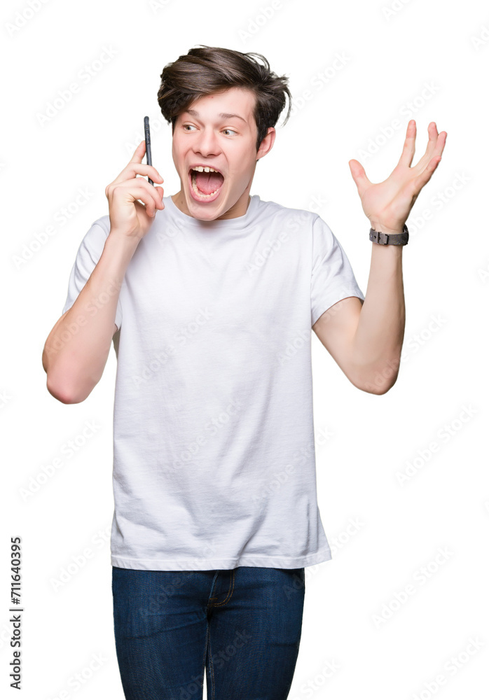 Young man talking on smartphone over isolated background very happy and excited, winner expression celebrating victory screaming with big smile and raised hands Young man talking on smartphone over isolated background very happy and excited, winner expression celebrating victory screaming with big smile and raised hands