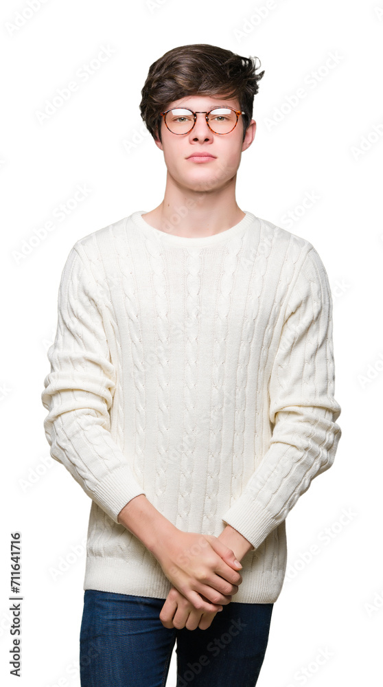 Young handsome man wearing glasses over isolated background Relaxed with serious expression on face. Simple and natural looking at the camera. Young handsome man wearing glasses over isolated background Relaxed with serious expression on face. Simple and natural looking at the camera.
