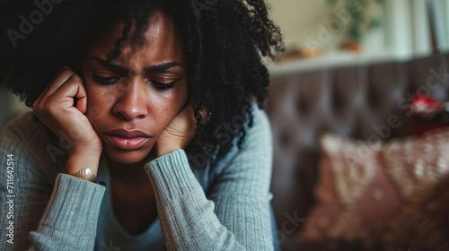 Black woman feeling depression symptoms alone at home