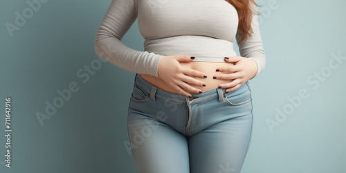 Woman with stomachache holds hands on belly. Female with intestinal inflammation touching abdomen. Lady with bloating sign of irritable bowel syndrome, farting, lactose intolerance and celiac disease.