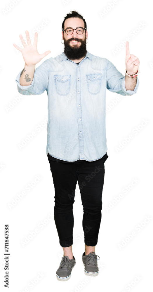 Young hipster man with long hair and beard wearing glasses showing and pointing up with fingers number six while smiling confident and happy. Young hipster man with long hair and beard wearing glasses showing and pointing up with fingers number six while smiling confident and happy.