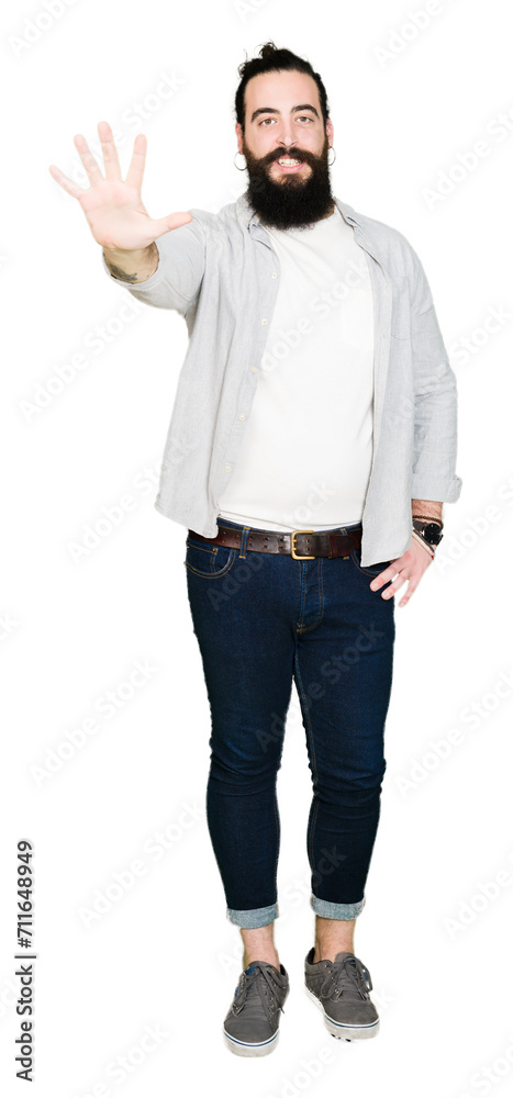 Young man with long hair, beard and earrings showing and pointing up with fingers number five while smiling confident and happy. Young man with long hair, beard and earrings showing and pointing up with fingers number five while smiling confident and happy.