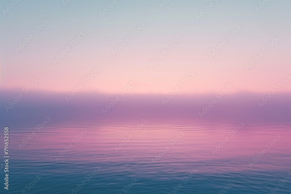 Calm pink and purple gradient over smooth water