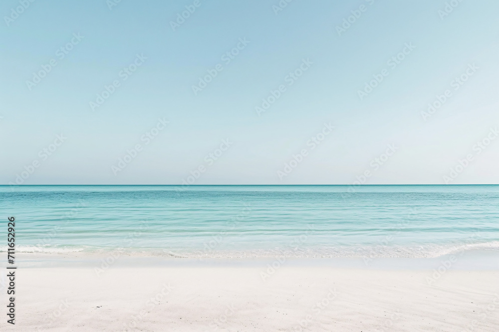 Serene beach scene with clear blue sky and calm sea
