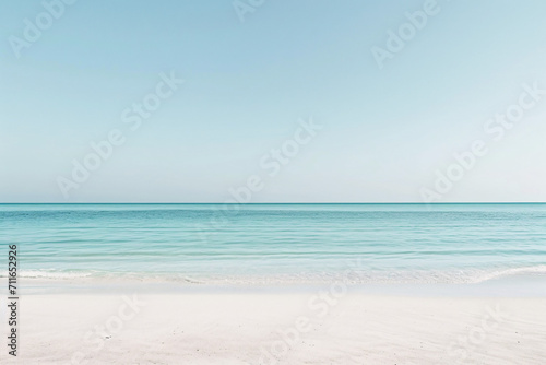 Serene beach scene with clear blue sky and calm sea