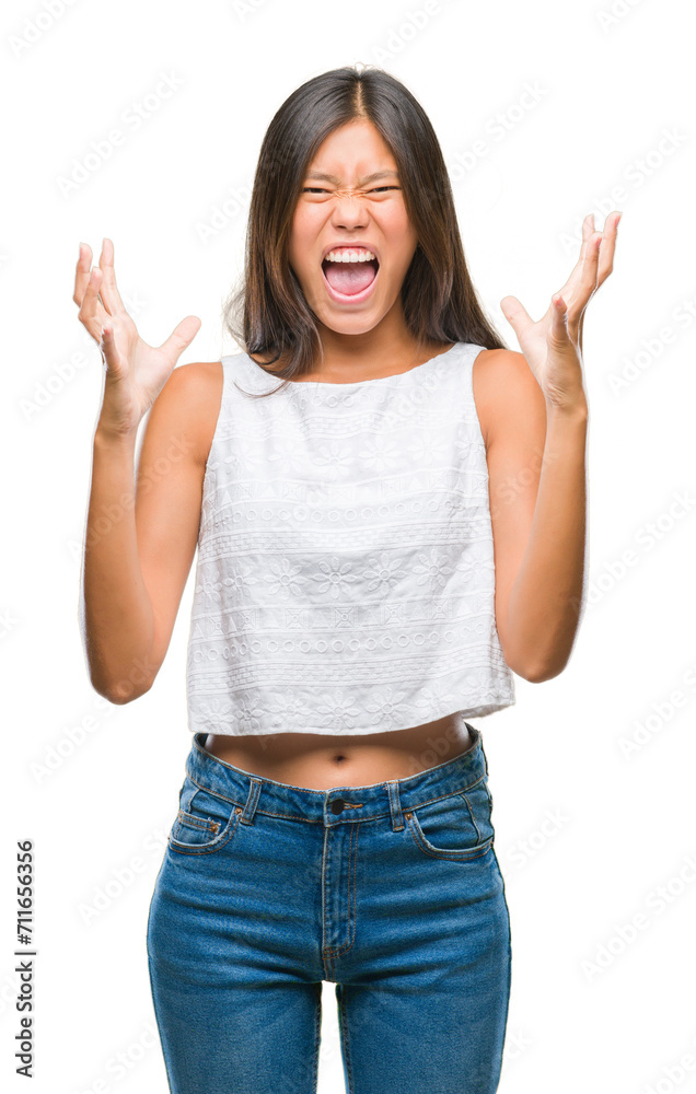 Young asian woman over isolated background crazy and mad shouting and yelling with aggressive expression and arms raised. Frustration concept. Young asian woman over isolated background crazy and mad shouting and yelling with aggressive expression and arms raised. Frustration concept.