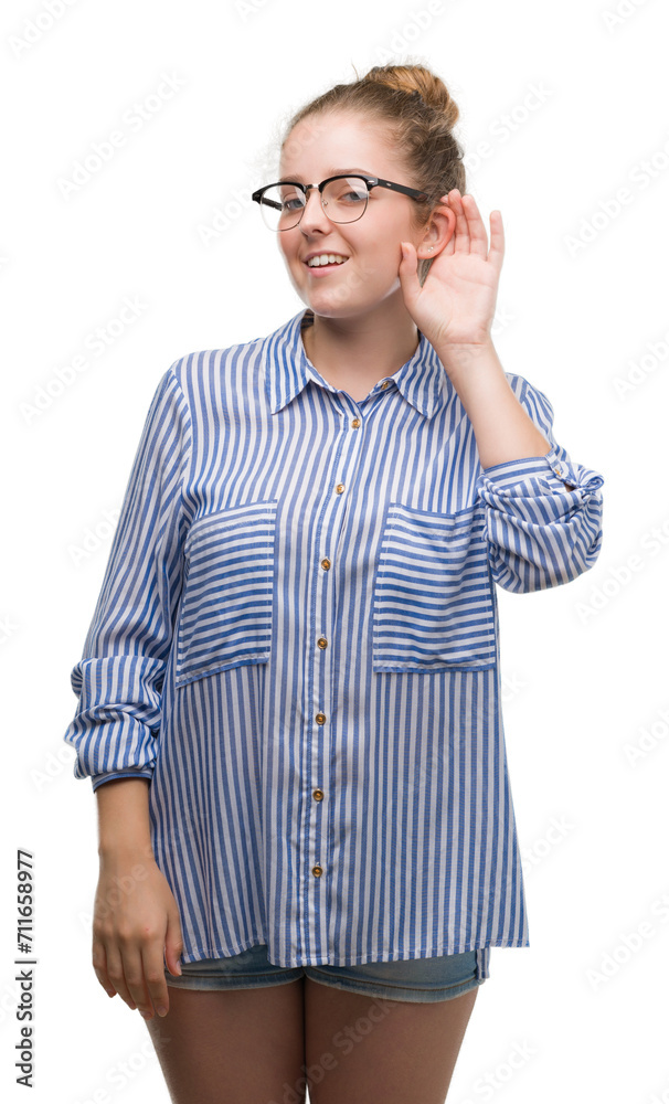 Young blonde business woman smiling with hand over ear listening an hearing to rumor or gossip. Deafness concept.