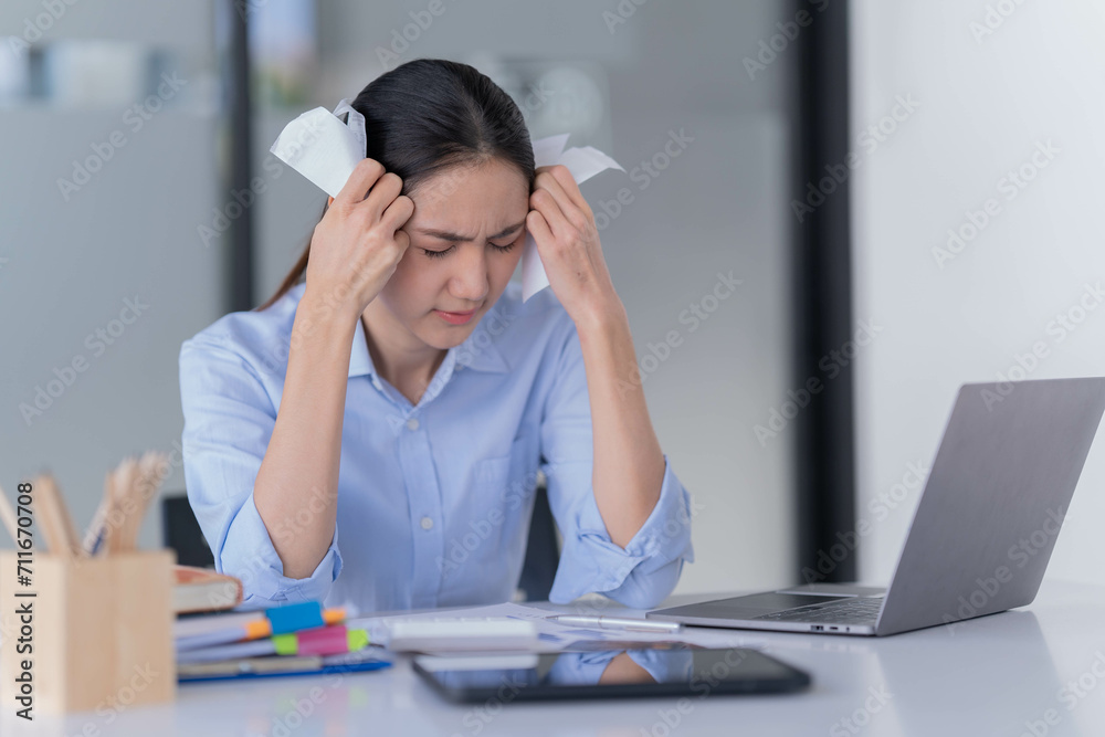 Asian businesswoman sitting in the office and be serious with her credit card bill. Asian businesswoman sitting in the office and be serious with her credit card bill.