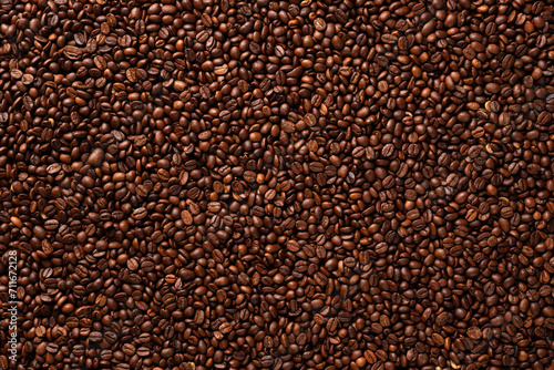 Top view of many roasted Arabica coffee beans.