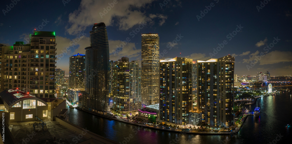 Aerial view of downtown district of of Miami Brickell in Florida, USA. Brightly illuminated high skyscraper buildings in modern american midtown