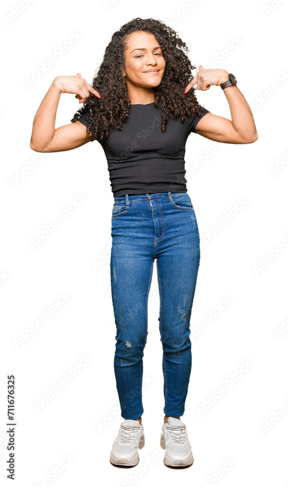Young beautiful woman with curly hair looking confident with smile on face, pointing oneself with fingers proud and happy. Young beautiful woman with curly hair looking confident with smile on face, pointing oneself with fingers proud and happy.