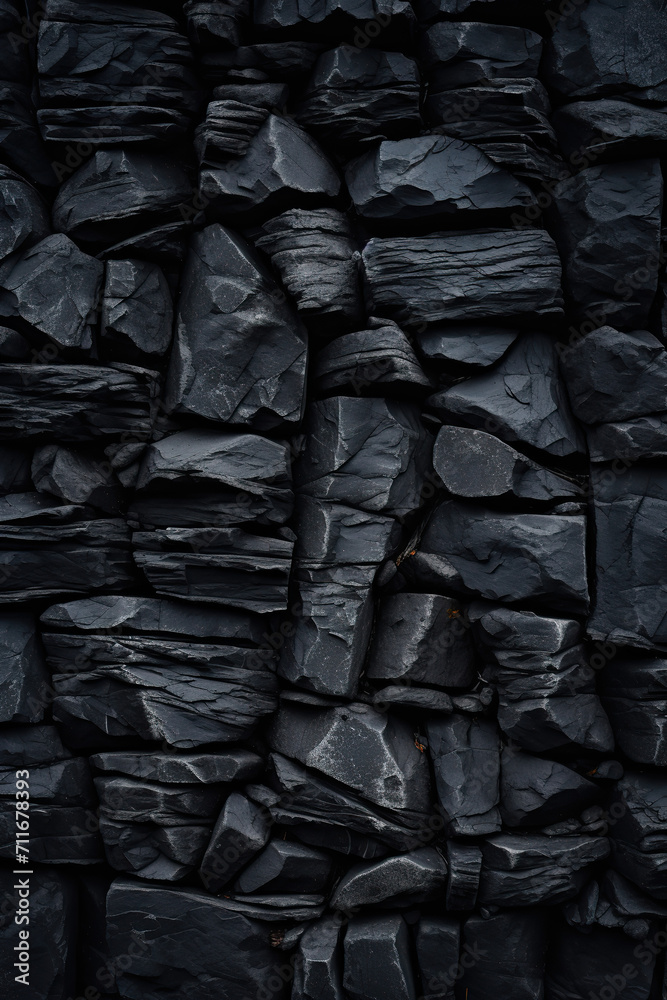 Black stone wall texture background. Natural pattern of black stone wall. Black stone wall texture background. Natural pattern of black stone wall.