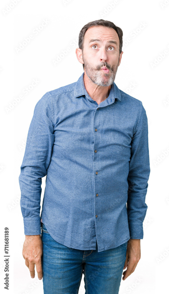 Handsome middle age elegant senior man over isolated background making fish face with lips, crazy and comical gesture. Funny expression. Handsome middle age elegant senior man over isolated background making fish face with lips, crazy and comical gesture. Funny expression.