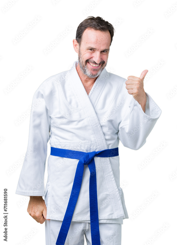 Handsome middle age senior man wearing kimono uniform over isolated background doing happy thumbs up gesture with hand. Approving expression looking at the camera showing success. Handsome middle age senior man wearing kimono uniform over isolated background doing happy thumbs up gesture with hand. Approving expression looking at the camera showing success.