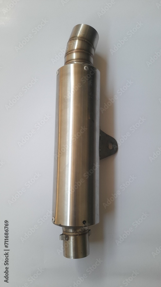 The top view of the racing motorbike exhaust is made of stainless steel white a background. background concept of transport, transportation, bike, motorcycle, lifestyle, business, shop, store, market The top view of the racing motorbike exhaust is made of stainless steel white a background. background concept of transport, transportation, bike, motorcycle, lifestyle, business, shop, store, market