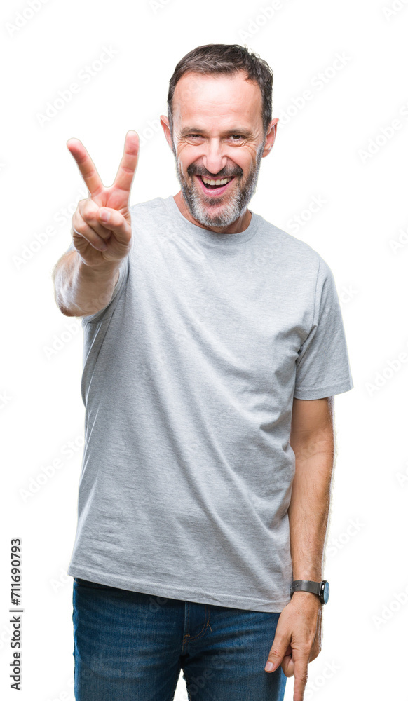 Middle age senior hoary man over isolated background smiling with happy face winking at the camera doing victory sign. Number two. Middle age senior hoary man over isolated background smiling with happy face winking at the camera doing victory sign. Number two.