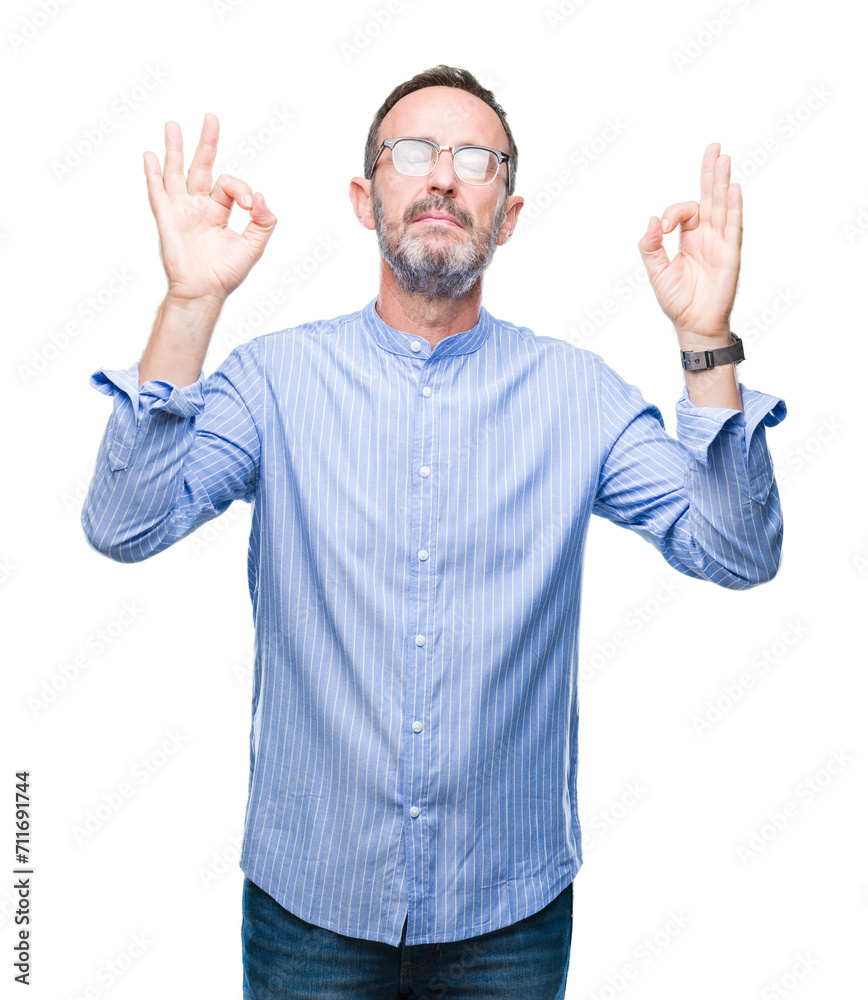Middle age hoary senior man wearing glasses over isolated background relax and smiling with eyes closed doing meditation gesture with fingers. Yoga concept. Middle age hoary senior man wearing glasses over isolated background relax and smiling with eyes closed doing meditation gesture with fingers. Yoga concept.