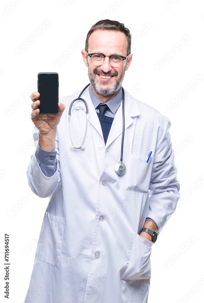 Middle age senior hoary doctor man showing smartphone screen over isolated background with a happy face standing and smiling with a confident smile showing teeth Middle age senior hoary doctor man showing smartphone screen over isolated background with a happy face standing and smiling with a confident smile showing teeth