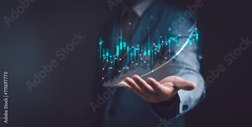 Investors or traders display virtual stock chart graphics on hands, concepts of analysis, investment planning and strategy, stock market, mutual funds, bonds, digital assets