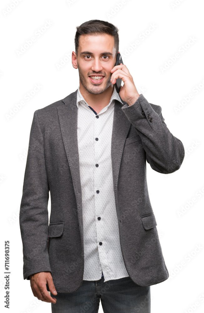 Handsome young man using smartphone with a happy face standing and smiling with a confident smile showing teeth Handsome young man using smartphone with a happy face standing and smiling with a confident smile showing teeth