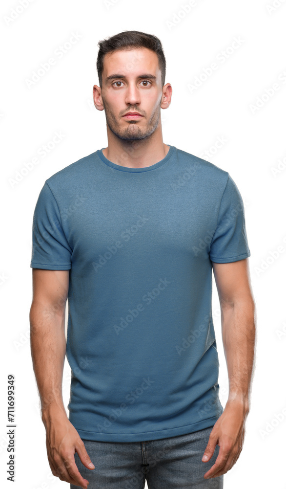 Handsome young casual man with serious expression on face. Simple and natural looking at the camera. Handsome young casual man with serious expression on face. Simple and natural looking at the camera.