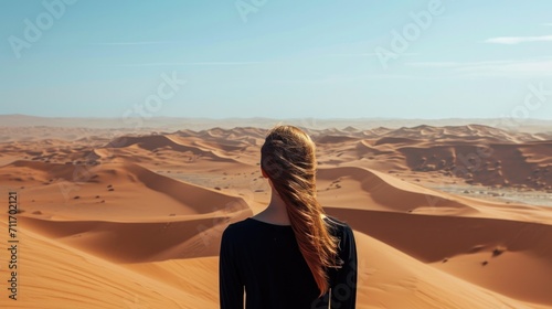 Woman from behind  looking at a vast desert landscape generative ai