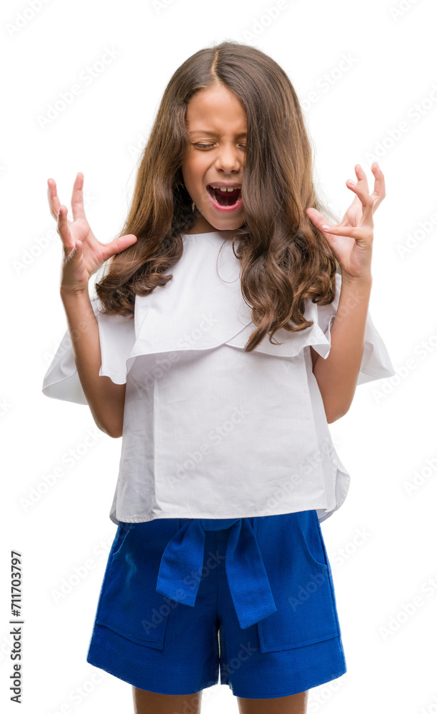 Brunette hispanic girl celebrating mad and crazy for success with arms raised and closed eyes screaming excited. Winner concept Brunette hispanic girl celebrating mad and crazy for success with arms raised and closed eyes screaming excited. Winner concept