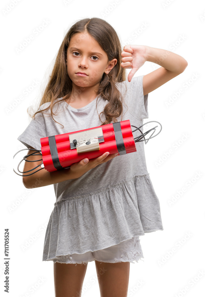 Brunette hispanic girl holding a bomb with angry face, negative sign showing dislike with thumbs down, rejection concept Brunette hispanic girl holding a bomb with angry face, negative sign showing dislike with thumbs down, rejection concept