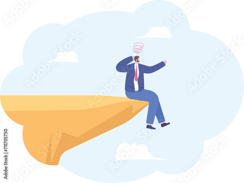 Businessman depressed sit on danger precipice on the mountain,

