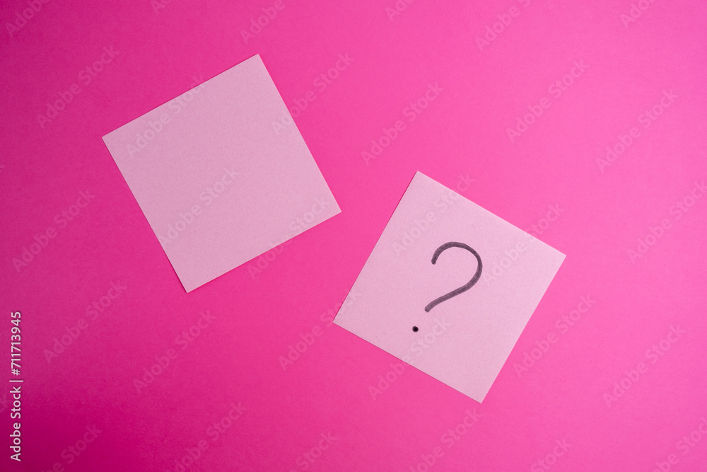 Pink paper with question mark on pink background. Place for text. Concept ideas and notes Pink paper with question mark on pink background. Place for text. Concept ideas and notes