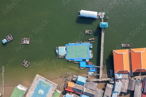 Aerial view of Koh Panyee, The Floating village urban city town houses, lake sea or river. Nature landscape fisheries and fishing tools at Pak Pha, Phang Nga, Thailand. Aquaculture farming © tampatra