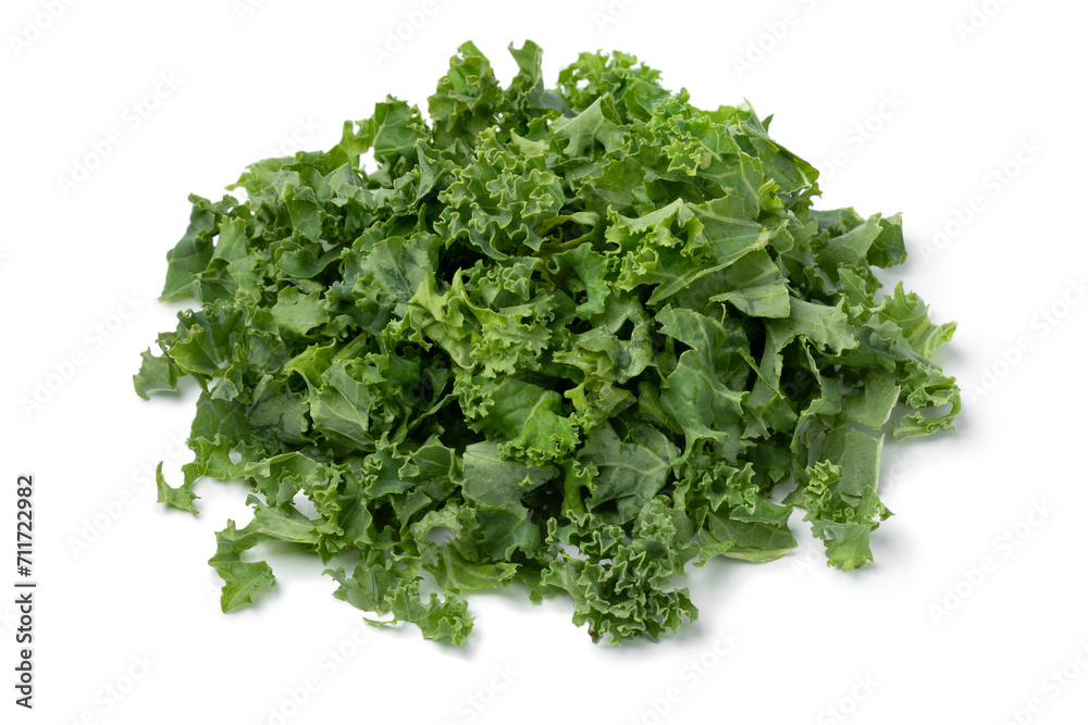 Heap of fresh cut green curly kale close up isolated on white background Heap of fresh cut green curly kale close up isolated on white background