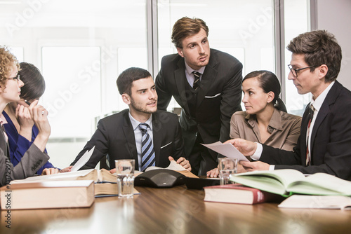 cheerful lawyers meeting in law office 
