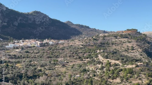 Panoramic view of the Hell's Ravine, or El Barranc de l'Infern, in La Vall de Laguar. One of the hardest hiking routes in Spain. The Cavall Verd mountain and the town Benimaurell are in the background photo