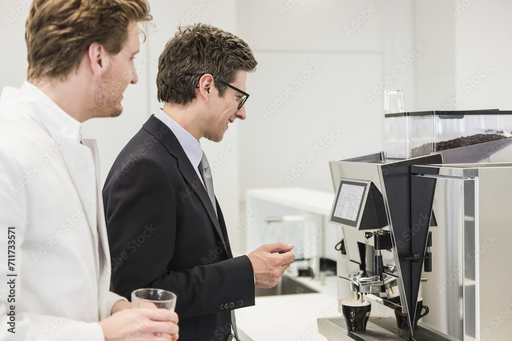 Colleagues at a pharmaceutical company get coffee together. Munich, Bavaria, Germany Colleagues at a pharmaceutical company get coffee together. Munich, Bavaria, Germany