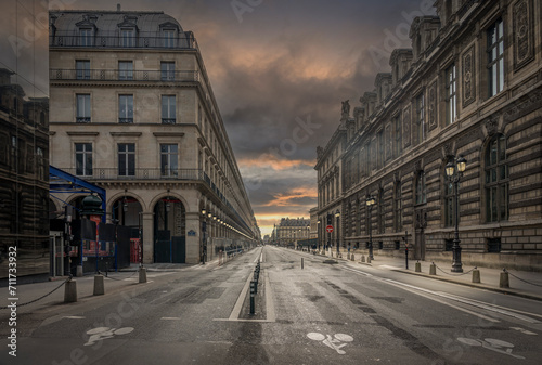 Paris, France - 09 23 2023: Rivoli Street at sunset with few people. photo
