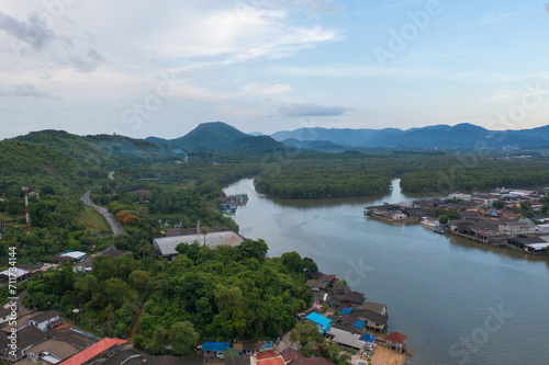 Aerial view of Ranong City, The Floating village urban city town houses, lake sea or river. Nature landscape fisheries and fishing tools, Thailand. Aquaculture farming © tampatra