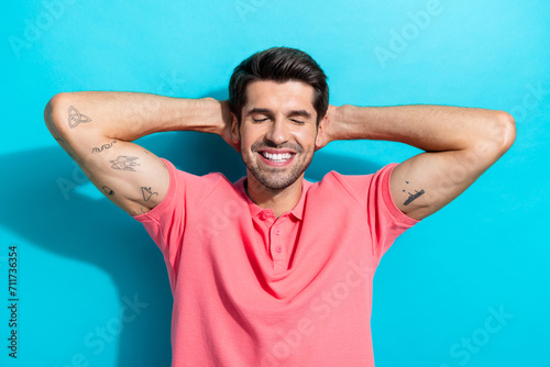 Photo portrait of young carefree young handsome guy take nap sleeping wear pink t shirt closed eyes isolated on aquamarine color background