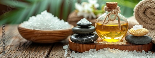 Spa on wooden table. beauty treatment items for spa massage stones  essential oils and sea salt
