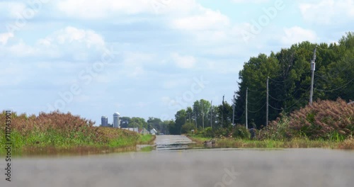Heat waves with car approaching on rural road
