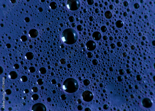 Abstract surface of floating bubbly spheres in a blue liquid. Cold gloomy bubble pattern  creating an otherworldly alien watery landscape. 