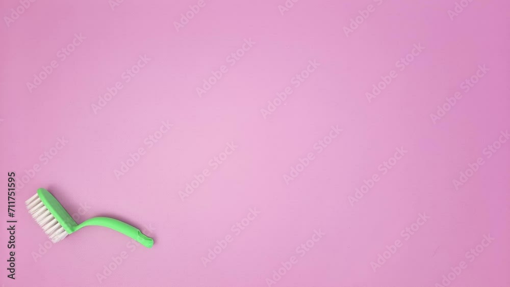 Cleaning items. Funny slow motion animation. Set of cleanliness products runs off a pink background. Template for advertising a hardware store, cleaning service. Concept of perfect purity.