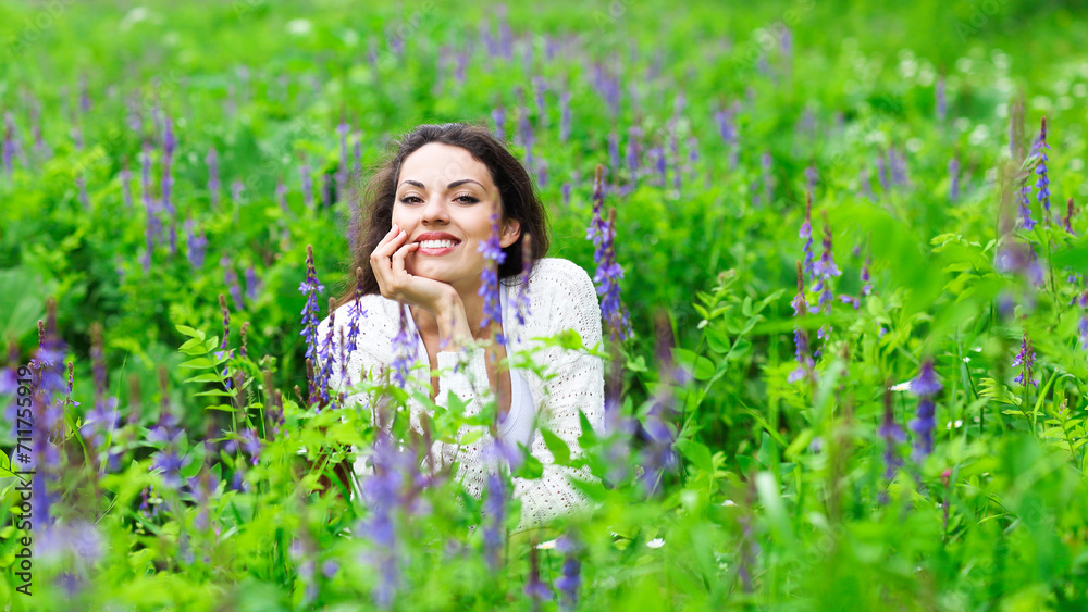 Happy pretty brunette woman in flower field Happy pretty brunette woman in flower field