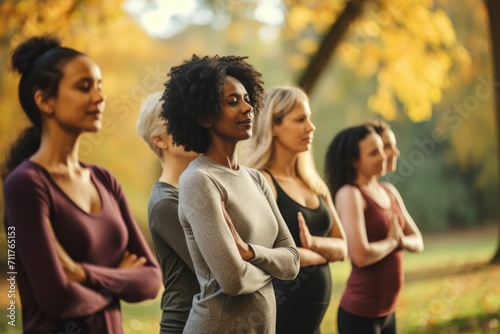 A group of women standing in a line in a park, enjoying a day outdoors, Group of multiethnic women stretching arms outdoor, Yoga class doing breathing exercise at park, AI Generated