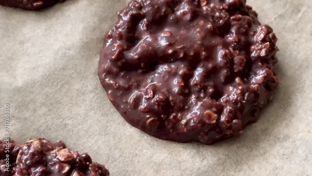 Baking sweet chocolate oat bisquits in the oven, homemade food recipe, slow motion Baking sweet chocolate oat bisquits in the oven, homemade food recipe, slow motion