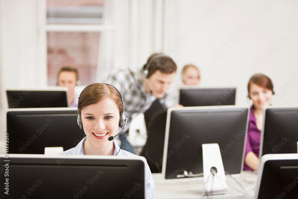 Colleagues working in a call center with a very friendly atmosphere. Munich, Germany Colleagues working in a call center with a very friendly atmosphere. Munich, Germany