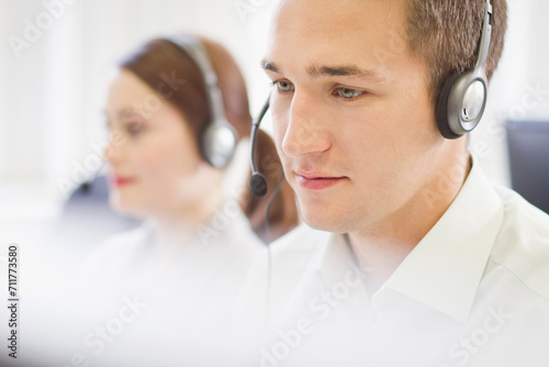 Colleagues working in a call center with a very friendly atmosphere. Munich, Germany