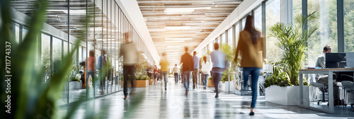 Businesspeople walking at modern office. Concept work process. Business workplace with people in walking in blurred motion in modern office space.