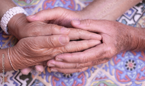 Close up on Seniors people holding hands together express care and psychological support, empathy, hope, concept of old people health care, group therapy