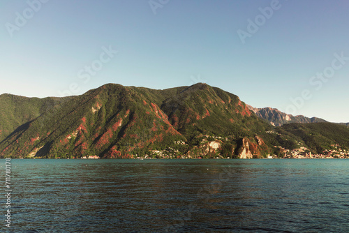 Lakeside Serenity with Red Foliaged Hills